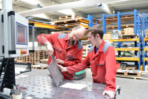 Instructor with student in Shop Class